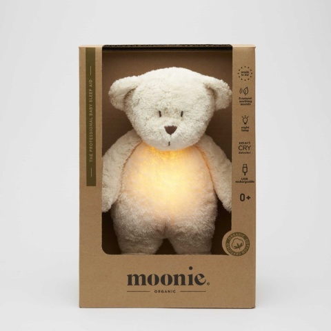 moonie szumiący miś z włączoną lampką w opakowaniu