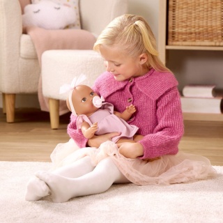 Śniada Lalka ze Smoczkiem LullaBaby w Sukience i Opasce