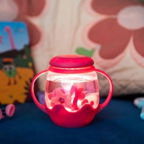 Różowy mini słoik sensoryczny Glo Pals z akcesoriami w śrdoku